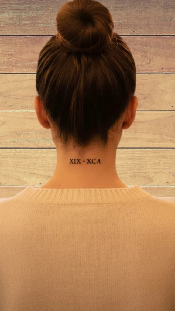 Roman Numerals at the Hairline Tattoo